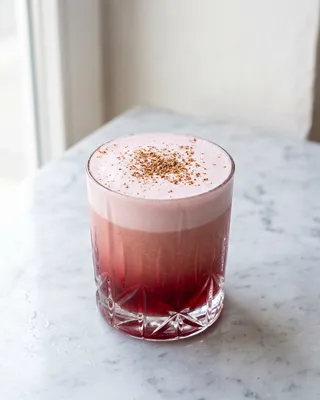 Hibiscus Tiki Sour in a lowball glass