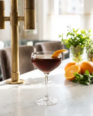 Hanky Panky in a coupe with orange