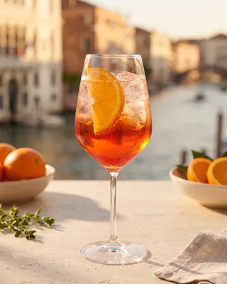 Campari Spritz in a wine glass with orange
