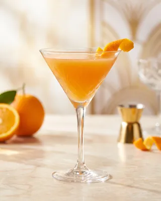 Paradise Cocktail in a martini glass with orange