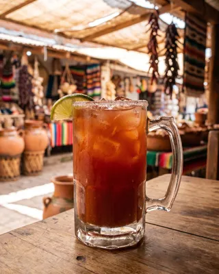 Michelada in a beer mug with lime