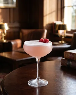 Clover Kiss in a coupe with raspberries