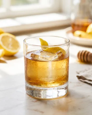 Gold Rush in a rocks glass with lemon
