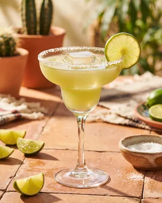 Margarita Pitcher served in a margarita glass with lime