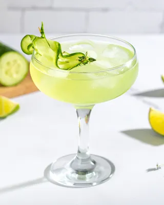 Eastside cocktail in a coupe with a cucumber garnish