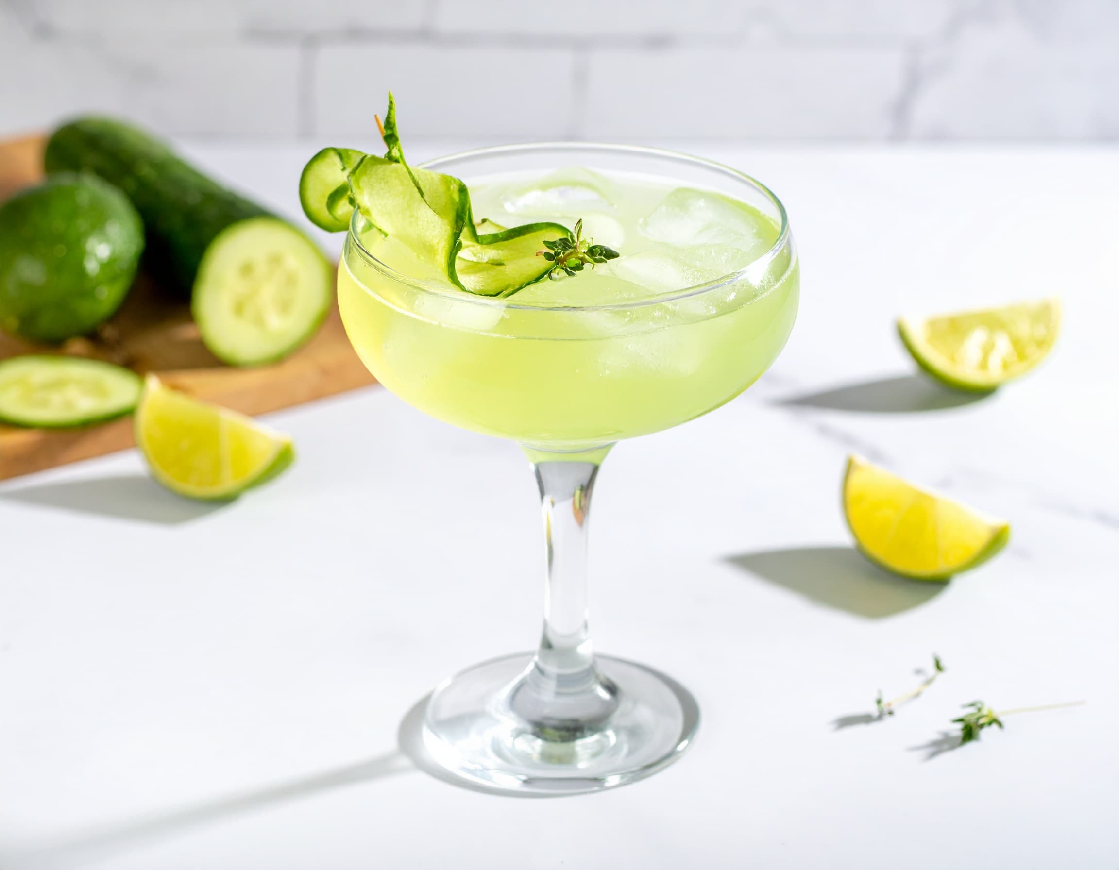 Eastside cocktail in a coupe with a cucumber garnish
