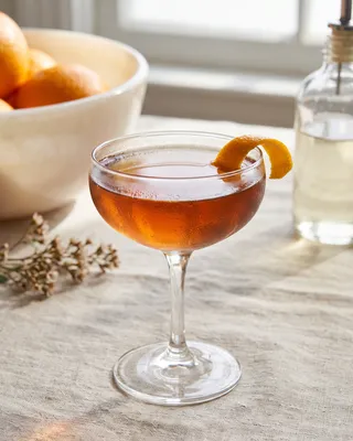 Revolver in a coupe with orange