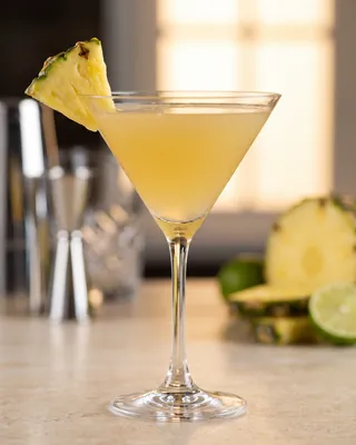 Pineapple Martini in a martini glass with pineapple