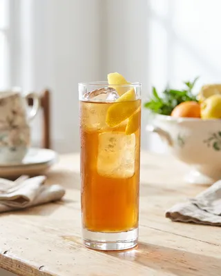 Chatham Artillery Punch in a Collins glass with lemon